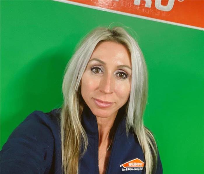 Photo of Brandy in front of SERVPRO sign