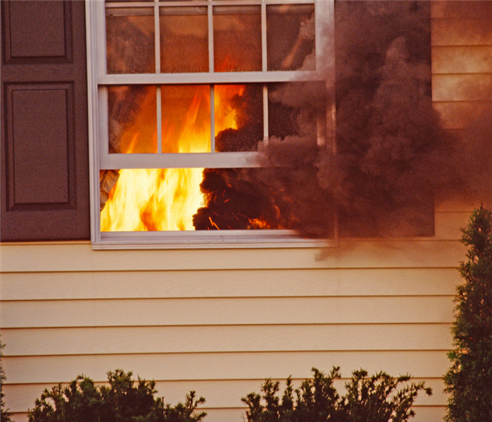 Fire inside window of house
